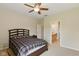 Inviting bedroom with a queen bed, neutral color scheme, and a partial view of the en-suite bathroom at 1484 N County Road 900 E, Avon, IN 46123