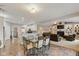 Open-concept dining area connects to a modern kitchen and living room at 1484 N County Road 900 E, Avon, IN 46123