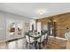 Bright dining room with a glass-top table, modern chairs, and a decorative wood accent wall at 1484 N County Road 900 E, Avon, IN 46123