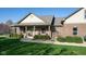 Charming brick home with well-maintained landscaping and a cozy front porch at 1484 N County Road 900 E, Avon, IN 46123