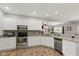 Well-equipped kitchen with granite counters, stainless steel appliances, and tiled floor at 1484 N County Road 900 E, Avon, IN 46123