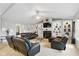 Bright living room with vaulted ceilings, a fireplace, and built-in shelving at 1484 N County Road 900 E, Avon, IN 46123