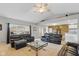 Bright and open living room with vaulted ceiling and comfortable black leather seating at 1484 N County Road 900 E, Avon, IN 46123