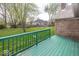 Spacious backyard featuring a large deck, mature trees, and a lush green lawn, perfect for outdoor entertaining at 1509 Copperwood Pl, Carmel, IN 46033