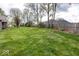Expansive backyard featuring large grassy area, fence line and mature trees at 1509 Copperwood Pl, Carmel, IN 46033