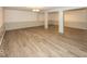 Spacious basement with light wood flooring and bright lighting at 1509 Copperwood Pl, Carmel, IN 46033
