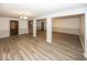 Wide view of basement with light wood flooring, support pillars, and recessed lighting at 1509 Copperwood Pl, Carmel, IN 46033