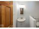 Traditional bathroom featuring white sink, cabinet, and toilet at 1509 Copperwood Pl, Carmel, IN 46033