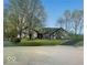 Attractive single Gathering home on a large lot with mature trees and a circular driveway at 1509 Copperwood Pl, Carmel, IN 46033