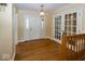 Spacious foyer boasts hardwood floors, white trim, and a decorative chandelier at 1509 Copperwood Pl, Carmel, IN 46033