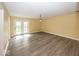 Spacious living room featuring wood-look floors and glass doors, offering a bright and airy space at 1509 Copperwood Pl, Carmel, IN 46033