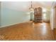 Large living room with a brick fireplace, vaulted ceilings, hardwood floors, and plenty of natural light at 1509 Copperwood Pl, Carmel, IN 46033