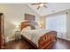 Comfortable bedroom features a vaulted ceiling, hardwood floors, and a cozy bed with decorative pillows at 15129 Smithfield Dr, Westfield, IN 46074