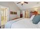 Relaxing bedroom with hardwood floors, neutral walls, and an open doorway leading to an adjacent bathroom at 15129 Smithfield Dr, Westfield, IN 46074