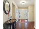 Welcoming foyer featuring hardwood floors, elegant decor, and a bright entryway at 15129 Smithfield Dr, Westfield, IN 46074