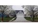 Charming two-story home featuring a well-manicured lawn, blooming trees, and a two-car garage at 15129 Smithfield Dr, Westfield, IN 46074