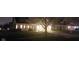 Charming home featuring a well-manicured lawn, mature trees, and a two-car garage at night at 15129 Smithfield Dr, Westfield, IN 46074