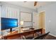 Functional home office with modern computer setup, stylish desk lamp, and natural light for a productive workspace at 15129 Smithfield Dr, Westfield, IN 46074