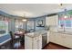 Eat-in kitchen featuring granite countertops, stainless steel appliances, and hardwood flooring at 15129 Smithfield Dr, Westfield, IN 46074