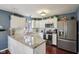Charming kitchen features granite countertops, stainless appliances, and a bright, inviting atmosphere at 15129 Smithfield Dr, Westfield, IN 46074