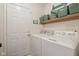 Functional laundry room with washer, dryer, and ample storage space at 15129 Smithfield Dr, Westfield, IN 46074