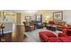 Bright living room featuring hardwood floors, comfortable seating, and plenty of natural light at 15129 Smithfield Dr, Westfield, IN 46074
