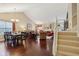 Open-concept living area with hardwood floors, staircase, and ample space for entertaining guests at 15129 Smithfield Dr, Westfield, IN 46074
