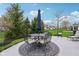 Outdoor patio featuring a round table with umbrella and comfortable cushioned chairs on decorative rug at 15129 Smithfield Dr, Westfield, IN 46074