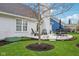 Cozy patio features an outdoor seating area, a well-maintained garden, and lush green grass at 15129 Smithfield Dr, Westfield, IN 46074