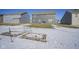 View of backyard with some snow, and garden beds, highlighting outdoor living at 15365 Todd S Ln, Fishers, IN 46037