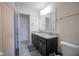 Bathroom with a double sink vanity, granite countertop, and dark wood cabinetry at 15365 Todd S Ln, Fishers, IN 46037