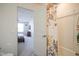 Bathroom featuring a shower with patterned curtain, wood-look flooring, and adjacent bedroom at 15365 Todd S Ln, Fishers, IN 46037