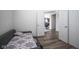 Bedroom with wood floors and a view into the hallway at 15365 Todd S Ln, Fishers, IN 46037