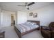 Comfortable bedroom with a ceiling fan, carpeted floor, and reading chair at 15365 Todd S Ln, Fishers, IN 46037