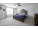 The carpeted bedroom features a ceiling fan and bed with dark wood furniture at 15365 Todd S Ln, Fishers, IN 46037