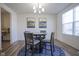 Bright dining room with a round table, four chairs, modern chandelier, and stylish blue rug at 15365 Todd S Ln, Fishers, IN 46037