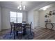 Dining room with a round glass table, hardwood floors and an entryway at 15365 Todd S Ln, Fishers, IN 46037
