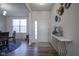 Entryway with wood floors, neutral decor, and a white entry door at 15365 Todd S Ln, Fishers, IN 46037