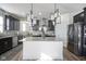 Modern kitchen with dark cabinetry, granite countertops, and stainless steel appliances at 15365 Todd S Ln, Fishers, IN 46037