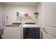 Laundry room features a front-load washer and dryer with wire shelf at 15365 Todd S Ln, Fishers, IN 46037
