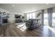 Spacious living room with a cozy fireplace, modern furnishings, and plenty of natural light at 15365 Todd S Ln, Fishers, IN 46037