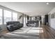 Bright and airy living room with large windows, hardwood floors, and modern decor at 15365 Todd S Ln, Fishers, IN 46037