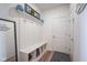 Organized mudroom featuring a built-in bench, hooks, and storage, perfect for keeping things tidy at 15365 Todd S Ln, Fishers, IN 46037