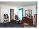 Bright bedroom with neutral walls, carpet and window treatments at 1631 Wilford Ln, Indianapolis, IN 46229