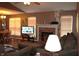 Inviting living room with a brick fireplace, neutral colors, and great natural light from large windows at 1631 Wilford Ln, Indianapolis, IN 46229