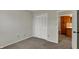 Bedroom featuring neutral walls, carpet flooring and closet with bi-fold doors at 1632 Queensbridge Sq # 7, Indianapolis, IN 46219