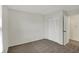 Bedroom featuring carpet flooring, neutral colored walls, and a closet with bi-fold doors at 1632 Queensbridge Sq # 7, Indianapolis, IN 46219