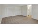 Neutral bedroom features plush carpeting and double door closet at 1632 Queensbridge Sq # 7, Indianapolis, IN 46219