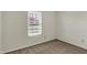 Bedroom featuring a window with blinds, carpet flooring, and neutral colored walls at 1632 Queensbridge Sq # 7, Indianapolis, IN 46219