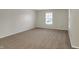 Spacious bedroom with plush carpet and lots of natural light at 1632 Queensbridge Sq # 7, Indianapolis, IN 46219